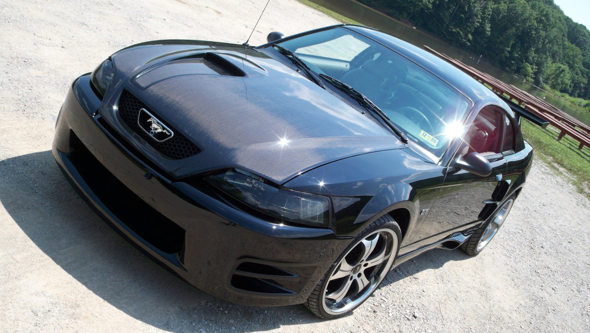 K019815FC FORD MUSTANG 1999-2004 HOOD CARBON. | Kaminari Aerodynamics, image size:1200x677